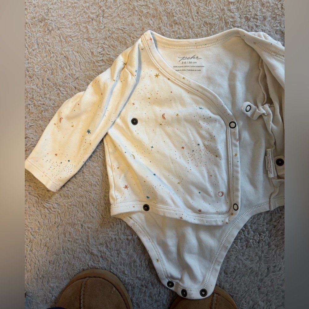 Cream Star & Moon Wrap-Front Long-Sleeve Baby One-Piece